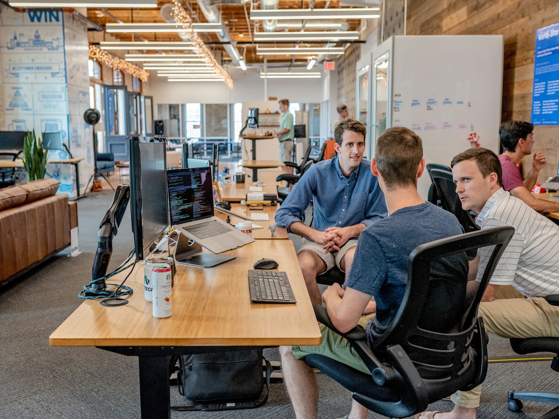 Content team planning editorial calendar around a whiteboard